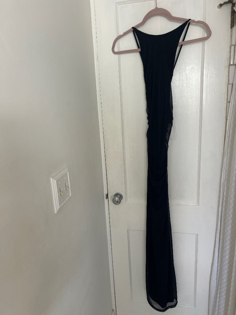 Woman’s long black dress open back